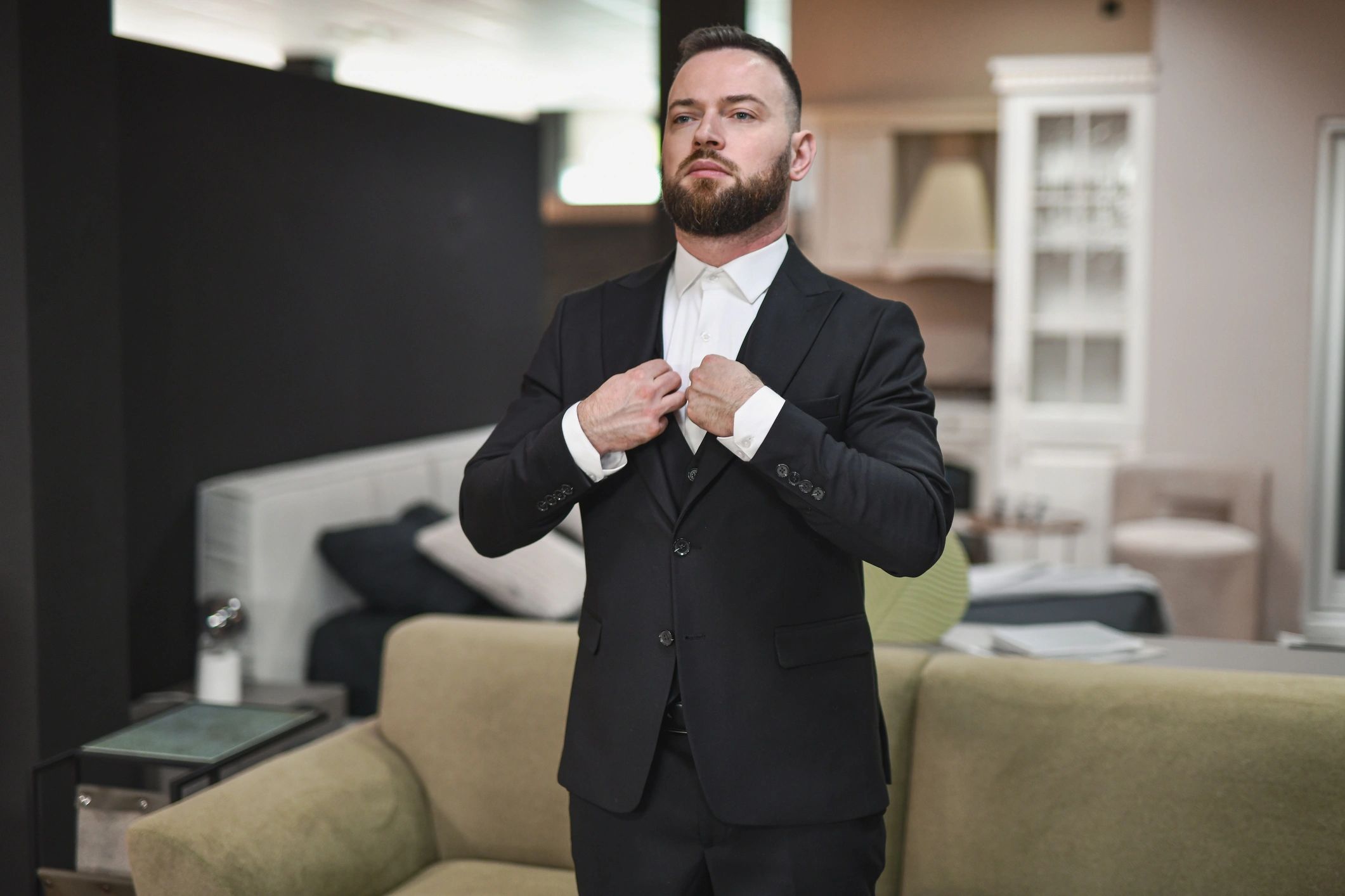 Man adjusting a tailored suit
